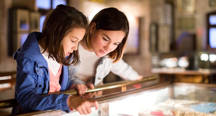 family looking at an exhibit